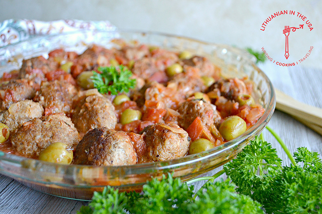 Baked Lithuanian pork meatballs with tomatoes and olives