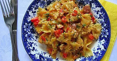 Pasta with smoked sausages and sour cream - tomato sauce