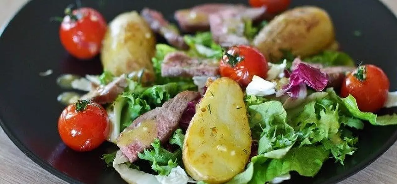 Salad with beef, fresh potatoes and tomatoes
